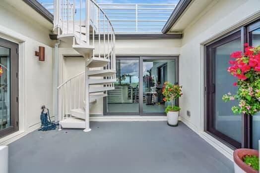 doorway to property with a patio area