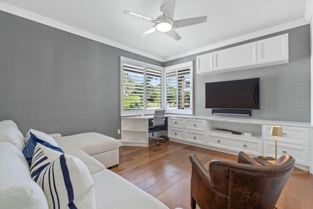 living room with wallpapered walls, ceiling fan, and wood finished floors