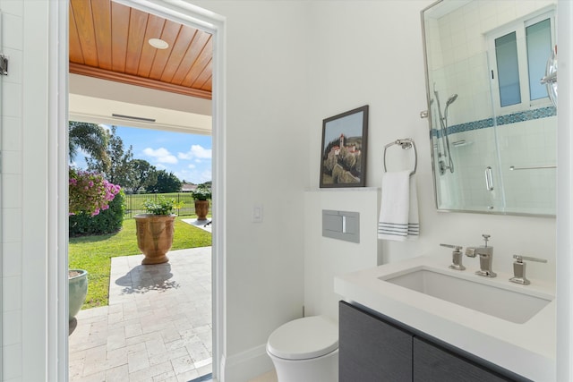 bathroom with wooden ceiling, toilet, vanity, baseboards, and a shower stall