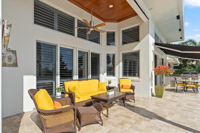 view of patio with area for grilling, outdoor lounge area, a ceiling fan, and outdoor dining space