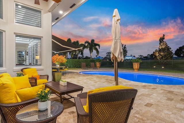 view of swimming pool featuring a patio area, a fenced backyard, outdoor lounge area, and a fenced in pool