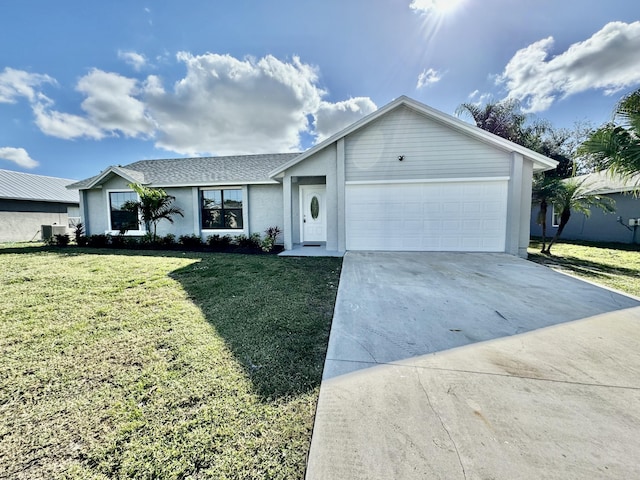 single story home with a garage and a front lawn