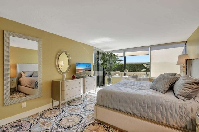 bedroom with floor to ceiling windows