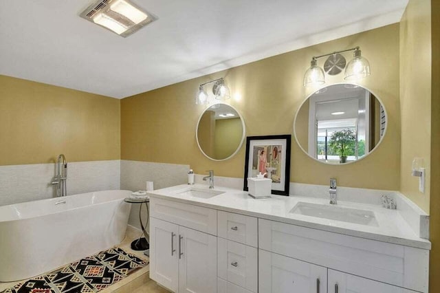 bathroom with vanity and a tub to relax in