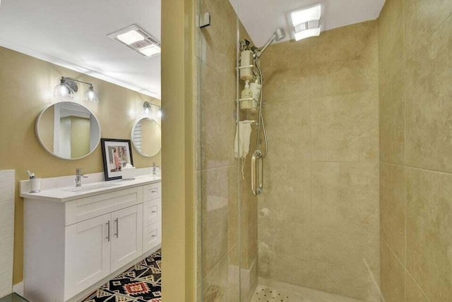 bathroom featuring vanity and a shower with door