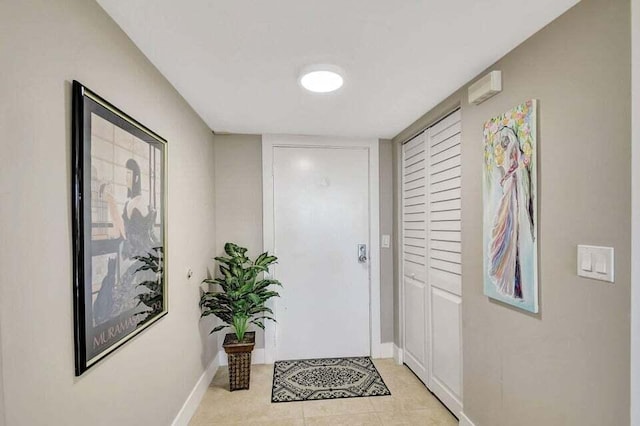 doorway featuring light tile patterned floors