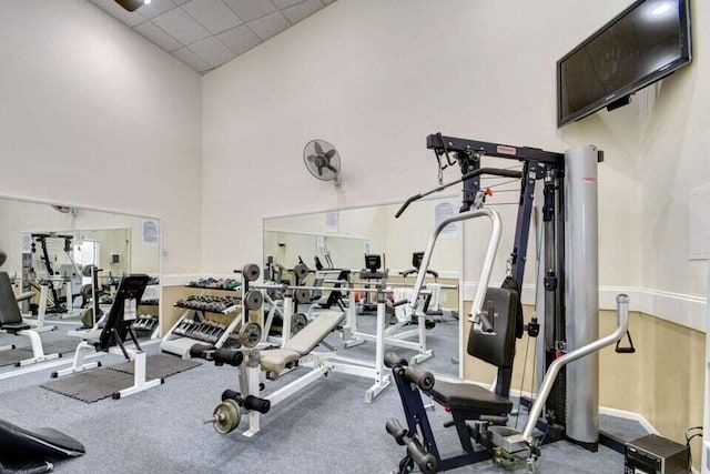 exercise room featuring a paneled ceiling