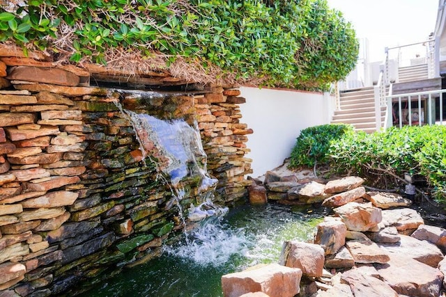 view of yard with a small pond