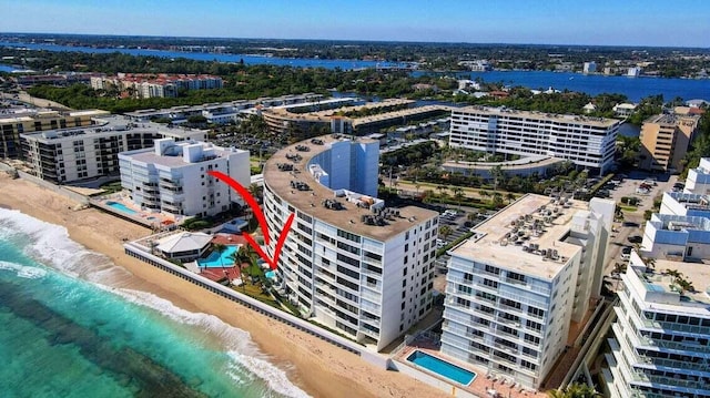 drone / aerial view with a view of the beach and a water view