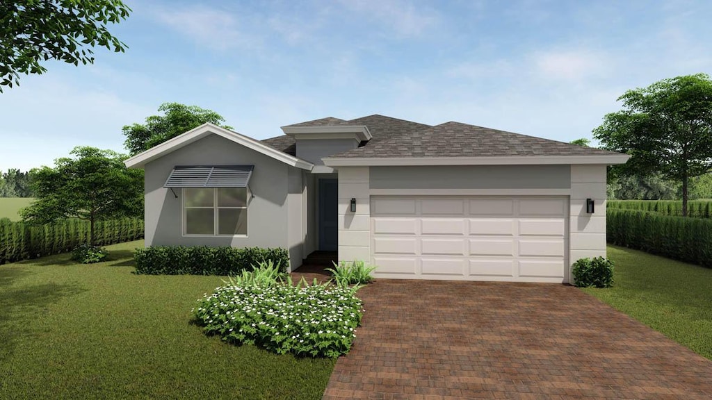 ranch-style house featuring a front yard and a garage