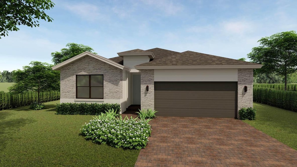 view of front facade with a garage and a front lawn