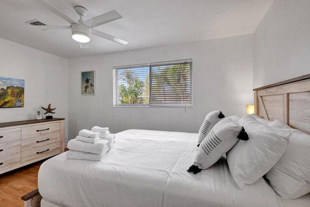 bedroom featuring hardwood / wood-style floors and ceiling fan