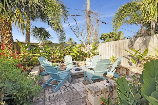 view of patio with a fire pit