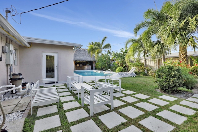 view of patio with a fenced in pool