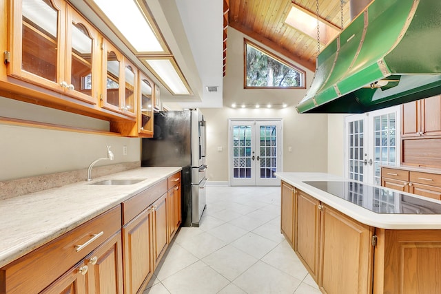 kitchen featuring french doors, a center island, wooden ceiling, extractor fan, and black appliances