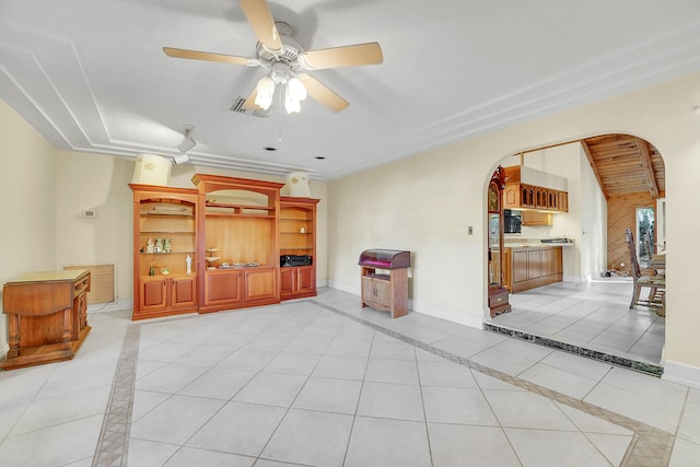 tiled living room featuring ceiling fan