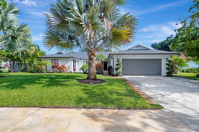 view of front of house featuring a garage and a front yard