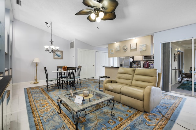 living room featuring ceiling fan with notable chandelier, vaulted ceiling, and light tile patterned flooring