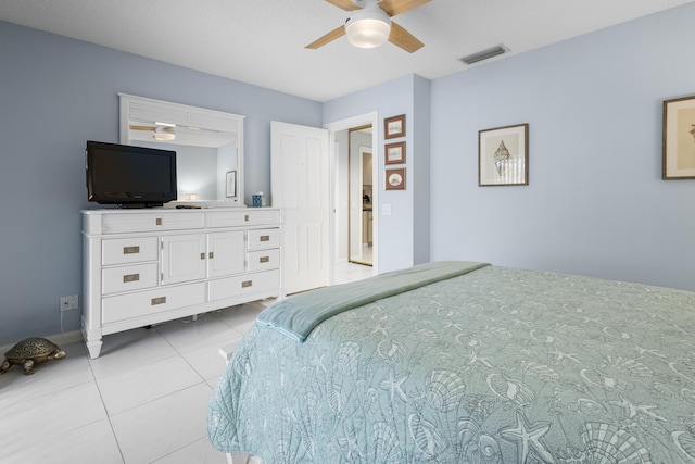 bedroom featuring ceiling fan and light tile patterned flooring