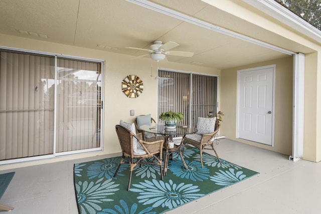 exterior space with ceiling fan