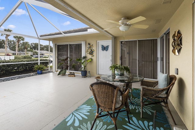 sunroom / solarium with ceiling fan