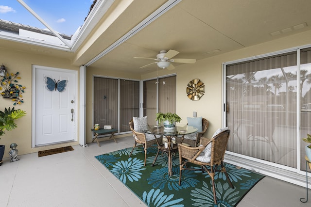 sunroom / solarium with ceiling fan