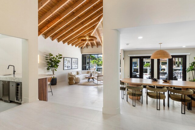 dining room featuring french doors and light tile patterned floors