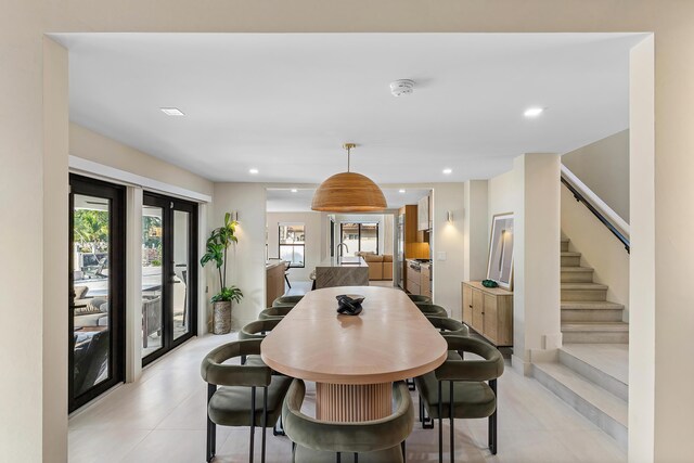 living room featuring a fireplace, a towering ceiling, and plenty of natural light