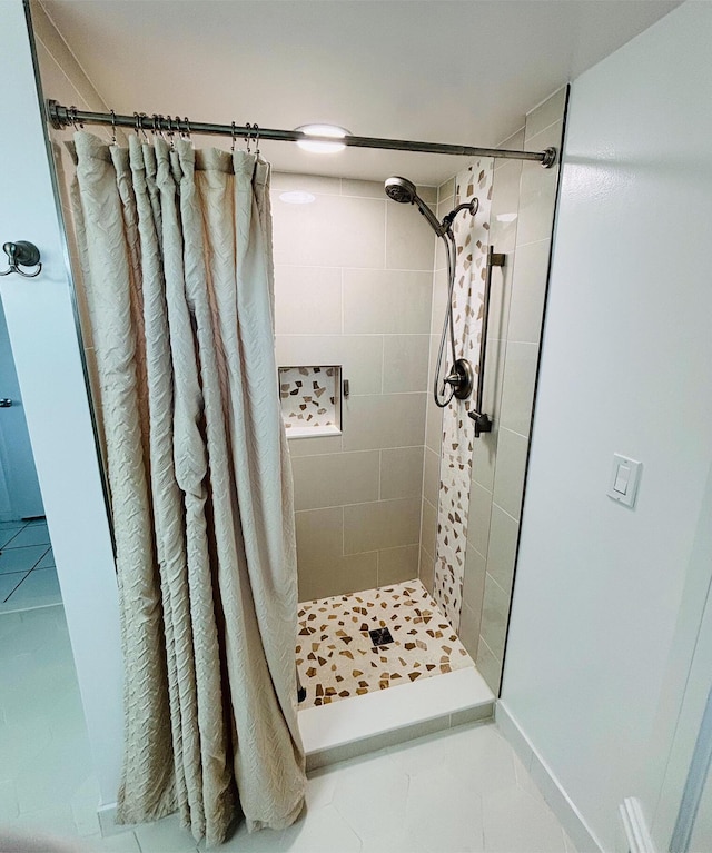 bathroom featuring tile patterned floors and walk in shower