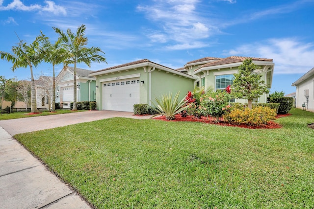 view of front of house with a garage and a front lawn