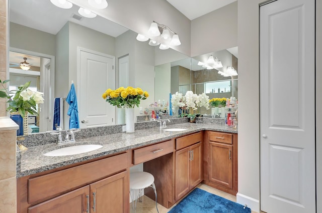 bathroom featuring tile patterned flooring, ceiling fan, a shower with shower door, and vanity