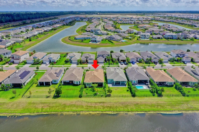 birds eye view of property with a water view