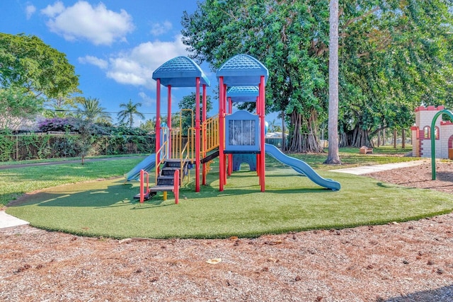 view of playground with a lawn