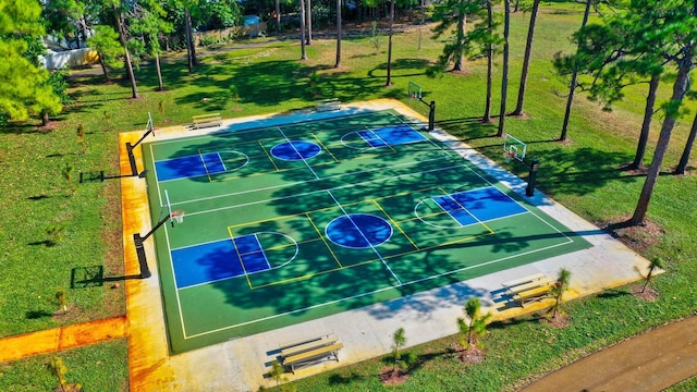 view of basketball court featuring a lawn