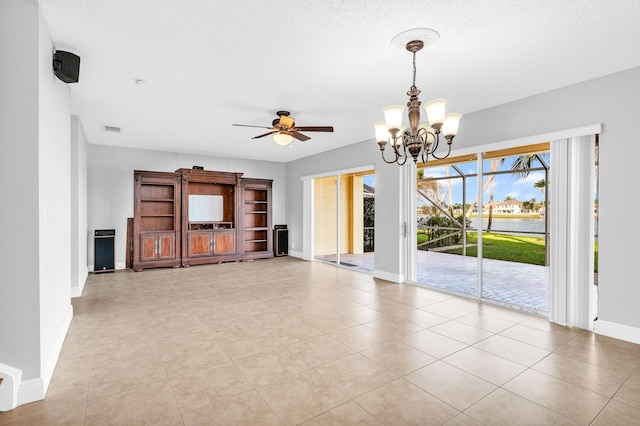 unfurnished living room featuring light tile patterned floors and ceiling fan with notable chandelier