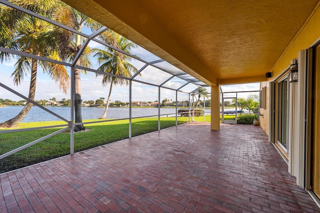 unfurnished sunroom with a water view