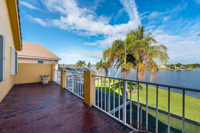 balcony featuring a water view