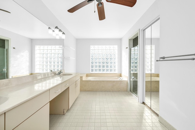 bathroom with vanity, separate shower and tub, a wealth of natural light, and ceiling fan