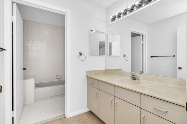 bathroom with tile patterned flooring and vanity