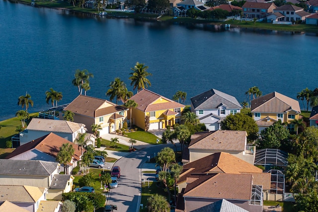 birds eye view of property featuring a water view