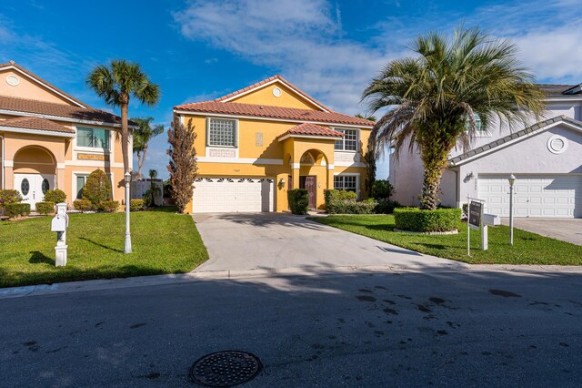 mediterranean / spanish-style home featuring a garage and a front lawn