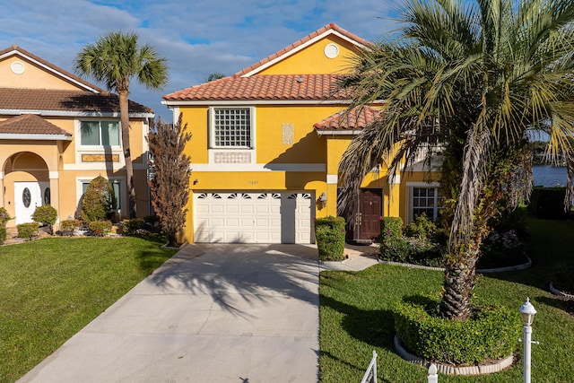 mediterranean / spanish-style house featuring a front lawn and a garage