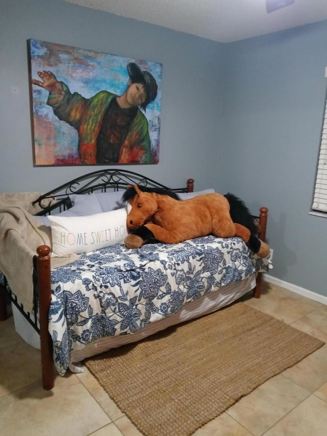 bedroom featuring tile patterned flooring