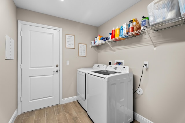 clothes washing area with washing machine and clothes dryer