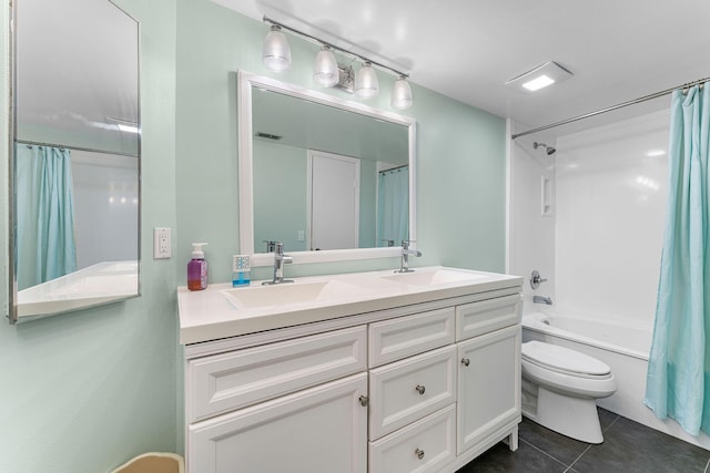 full bathroom with tile patterned floors, toilet, vanity, and shower / tub combo