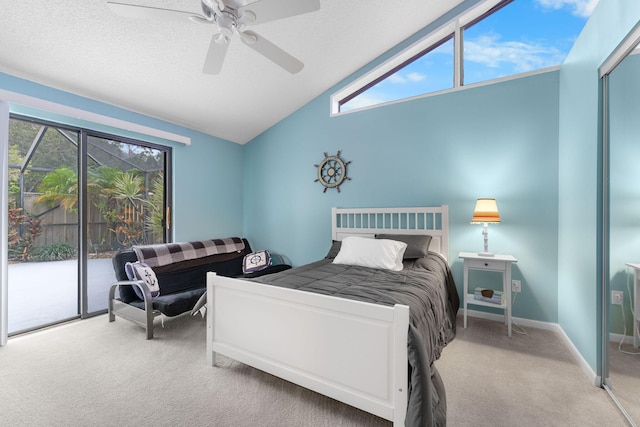 carpeted bedroom featuring ceiling fan, multiple windows, lofted ceiling, and access to outside