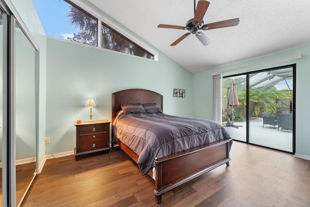 bedroom featuring a textured ceiling, ceiling fan, hardwood / wood-style floors, and access to outside