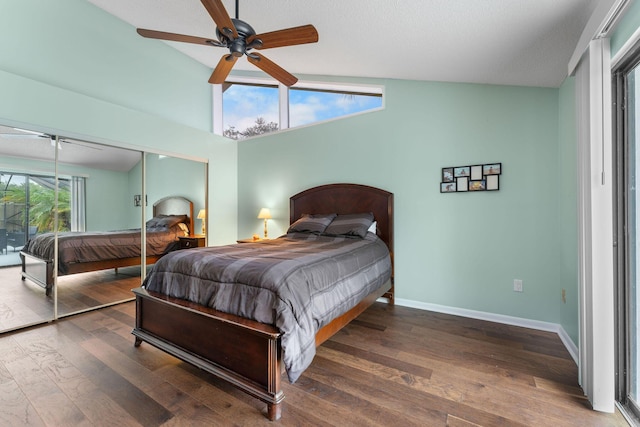 bedroom with ceiling fan, a closet, dark hardwood / wood-style floors, and multiple windows