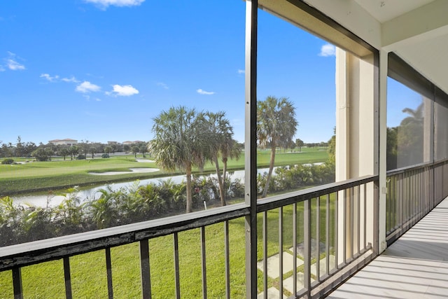 unfurnished sunroom with a water view