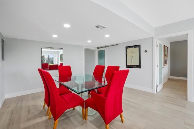 dining space with light wood-type flooring